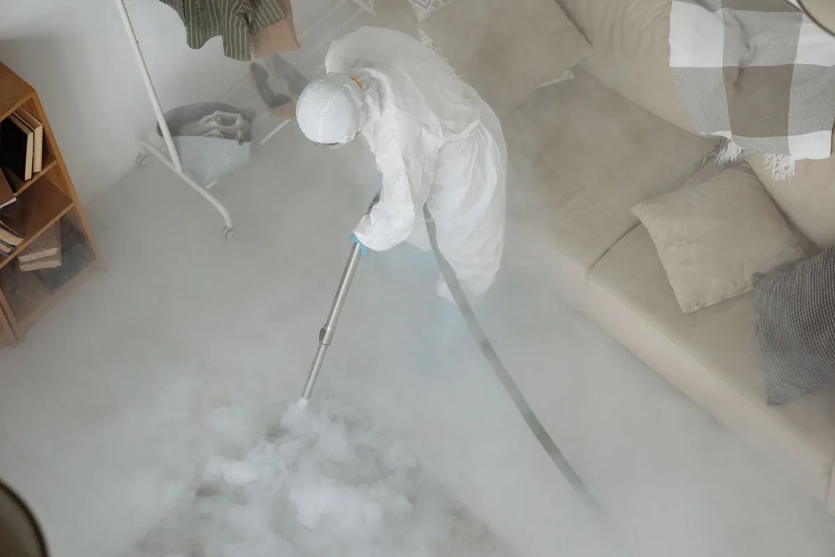 Biohazard cleanup technician in protective equipment, Mount Olive, MS